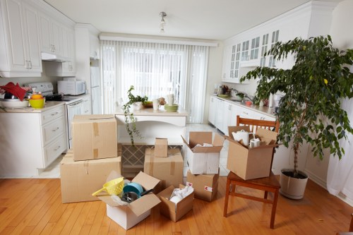 Team handling workstations and IT items during an office relocation